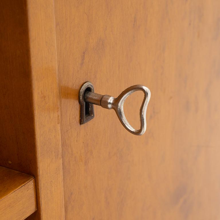 A birch wood book case with cabinet, 1930s.