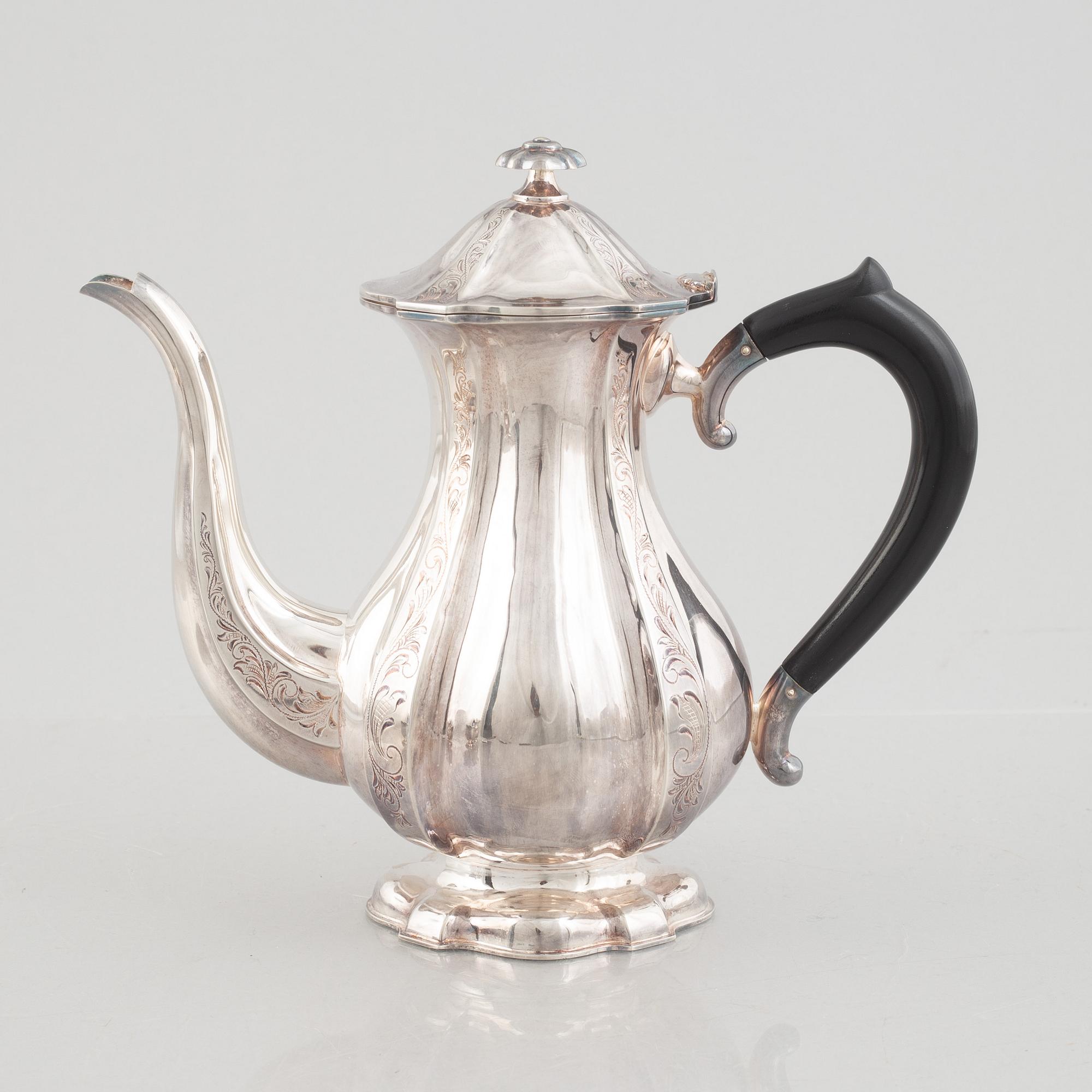 A silver coffee pot, creamer and sugarbowl, Swedish import marks, JL Hultman, circa mid-20th century.