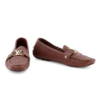 LOUIS VUITTON, a pair of brown leather loafers.