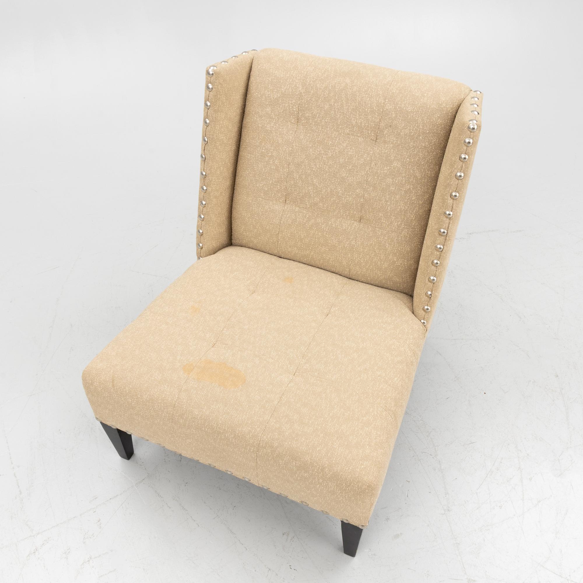 A pair of 'Triton custom chair' lounge chairs, Andrew & Martin, England, 21st century.
