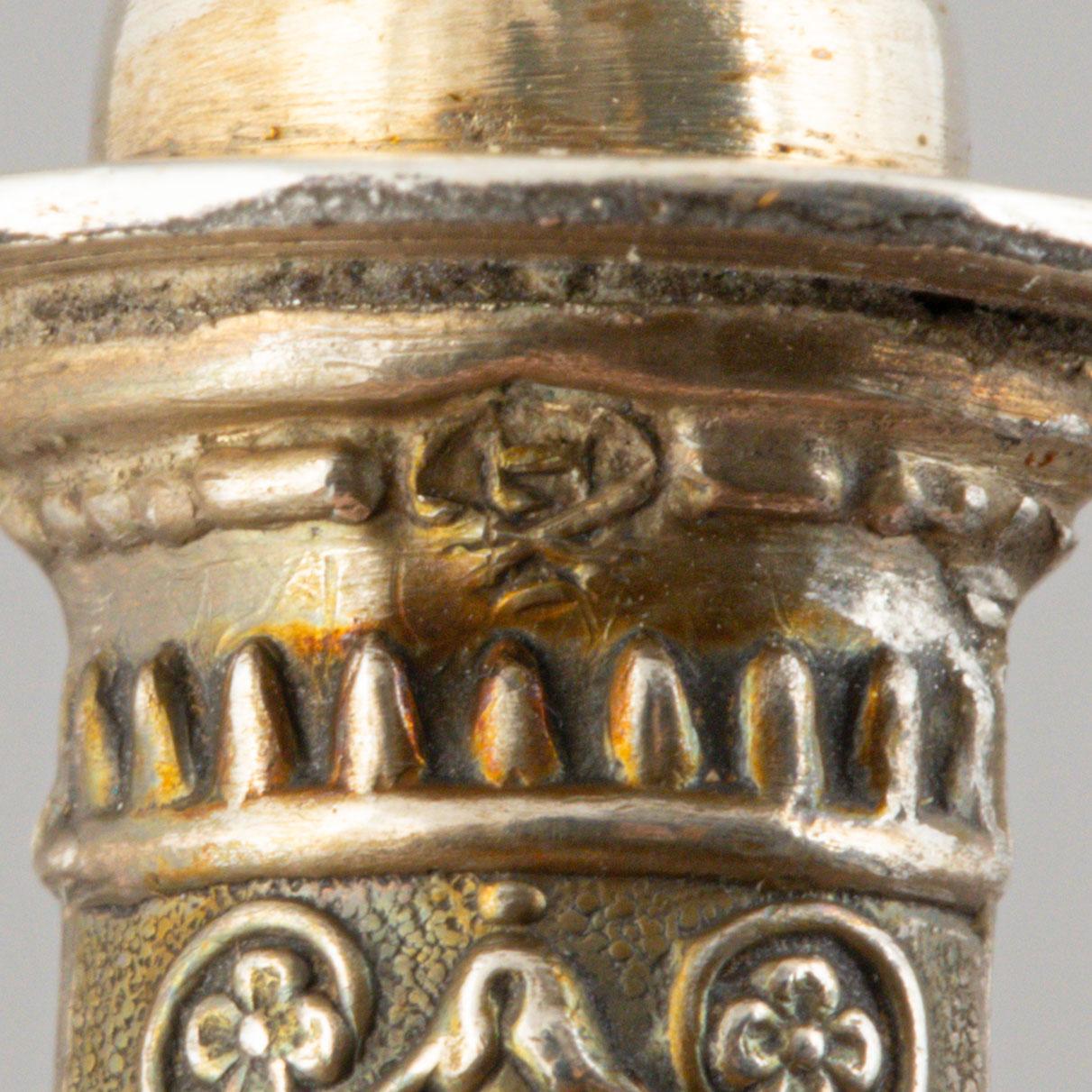 A set of six French silver pork chop holders, circa 1900.