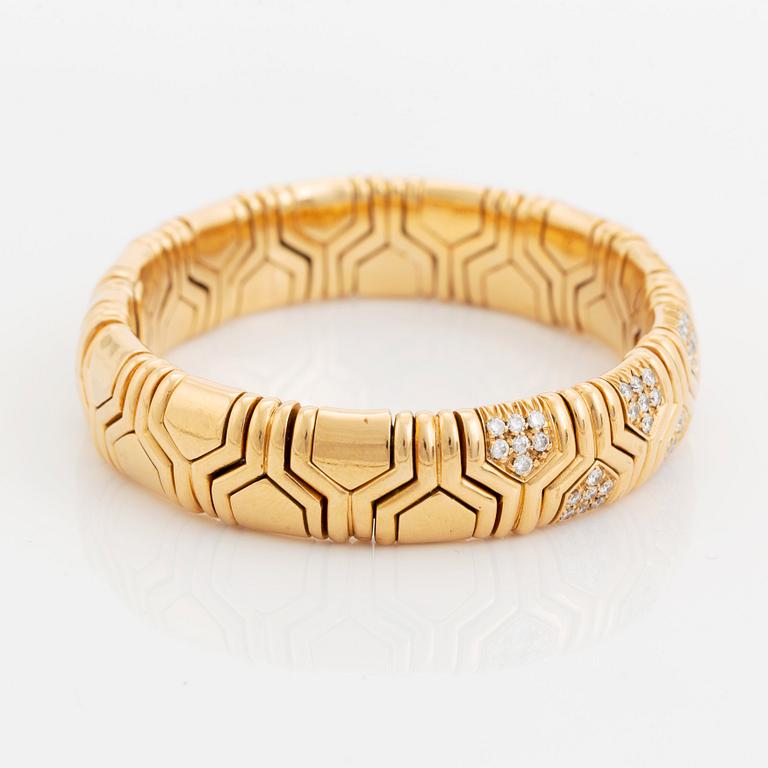 An 18K gold Bulgari bracelet set with round brilliant-cut diamonds.