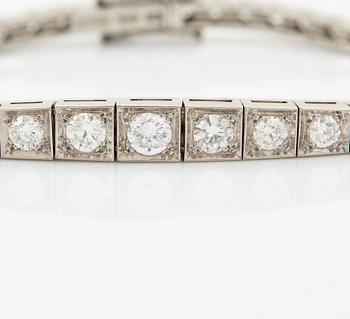 A platinum bracelet set with round brilliant-cut diamonds.