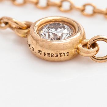 Tiffany & Co, Elsa Peretti, an 18K gold 'Diamonds by The Yard' ring with a brilliant-cut diamond.