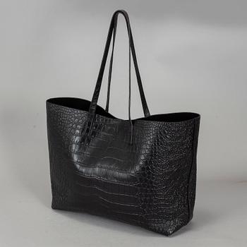 YVES SAINT LAURENT, a black patent leather shopper.