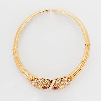 A necklace and a braclet in 18K gold set with faceted rubies.