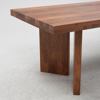 Dusty Deco, a contemporary walnut dining table.