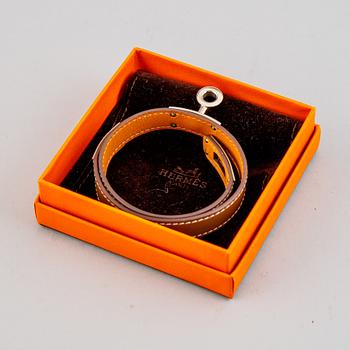 Hermès, a taupe leather 'Kelly Double' bracelet, size XS, 2013.