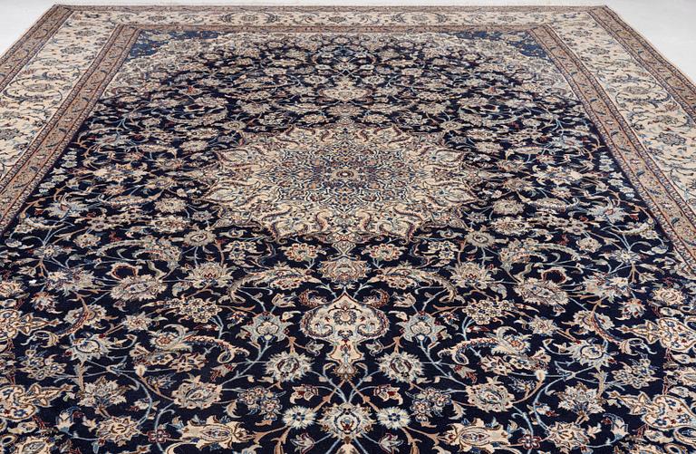 A Nain part silk carpet, c. 535 x 340 cm.