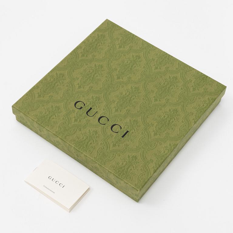 Gucci, a silk scarf.