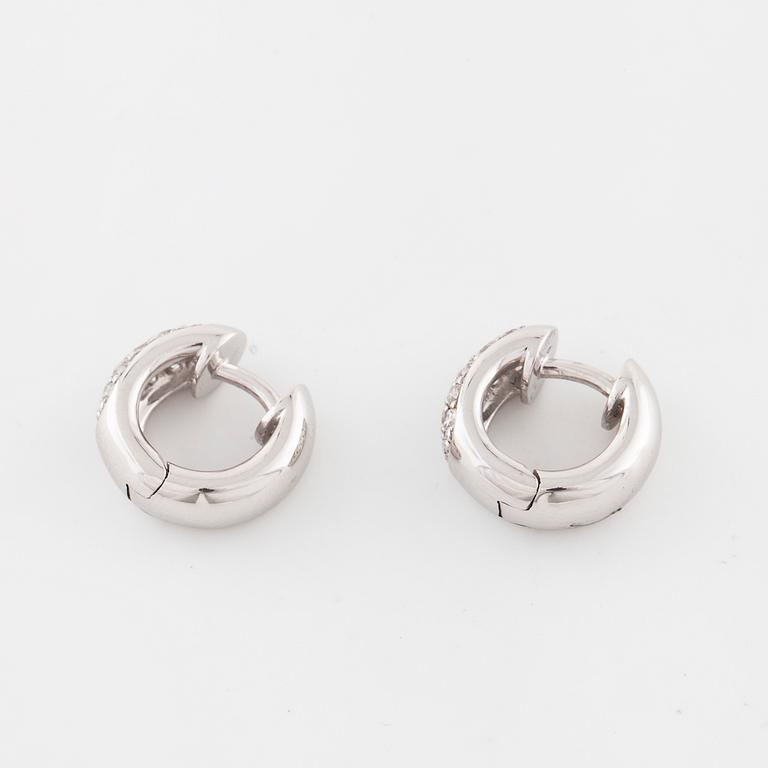 A pair of brilliant cut diamond earrings..