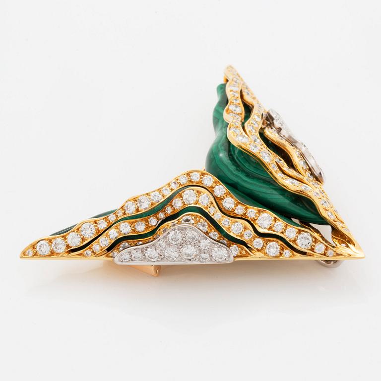 An 18K gold and malachite brooch and pair of earrings set with round brilliant-cut diamonds.