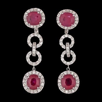 1078. A pair of ruby and brilliant cut diamond earrings, total carat weight circa 2.20 cts.
