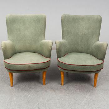 A pair of Swedish easy chairs, mid 20th Century.