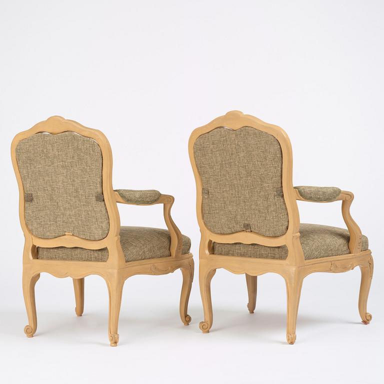 A pair of Swedish Rococo fauteuils à la reine, Stockholm, later part of the 18th century..