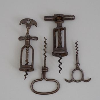 FOUR CAST IRON CORK SCREWS, 19th century.