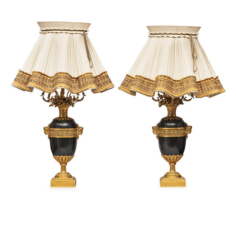 A pair of gilt and patinated bronze table lamps signed and dated by Henry Dasson 1877.