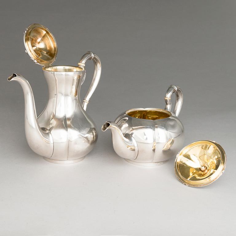 SAZIKOV, A 5-piece silver coffee and tea set, mark of the Sazikov Firm, Imperial Warrant, Saint Petersburg 1860.