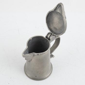 A pewter measuring cup by an unidentified master, dated 1766.