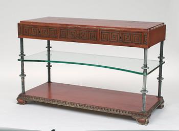 An Axel-Einar Hjorth red lacquered console table "Åbo" with silverplated brass legs, a glass shelf, Nordiska Kompaniet 1929-30.