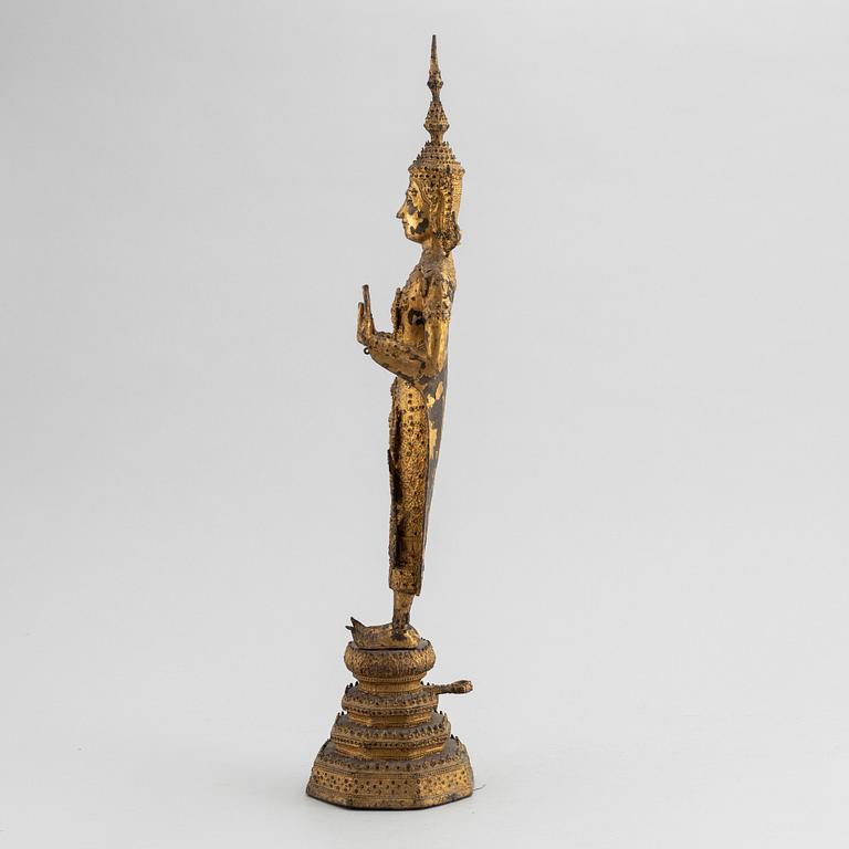 A Thai gilt bronze of standing Buddha Sakyamuni, 19th Century.