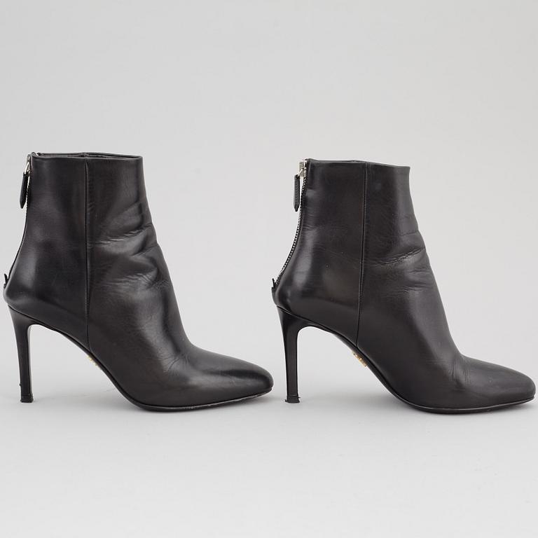 PRADA, a pair of black leather boots, size 35.