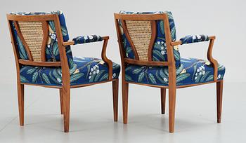 A pair of Josef Frank mahogany and ratten armchairs, Svenskt Tenn,
