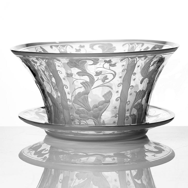 Simon Gate, a Swedish Grace engraved glass bowl with stand, Orrefors 1930, model 147, engraved by Karl Rössler.