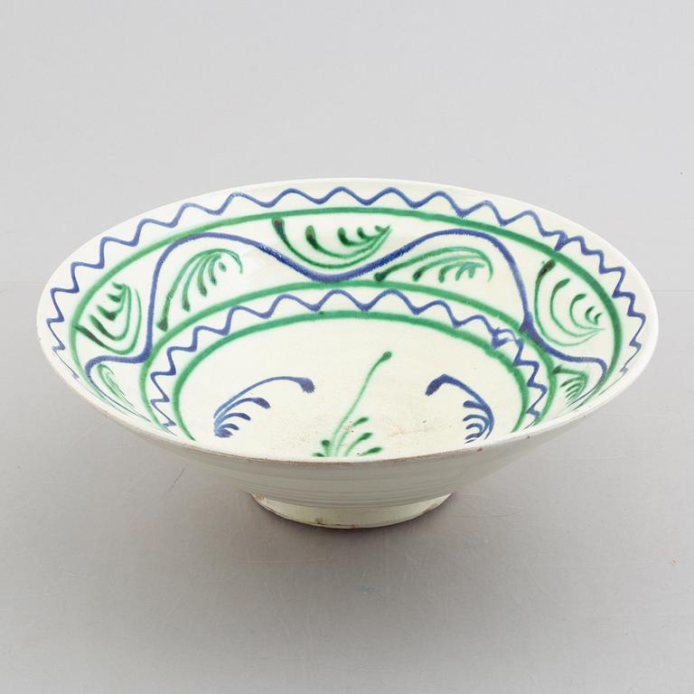 A faience bowl, circa 1900.