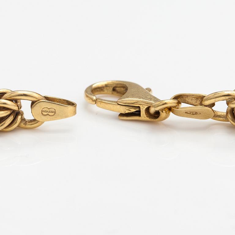 An 18K gold necklace. Unoaerre, Italy.