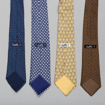 A set of four silk ties by Hermès.