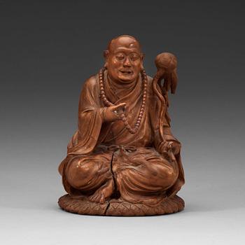 154. A Chinese wooden figure of a daoist dignitary.