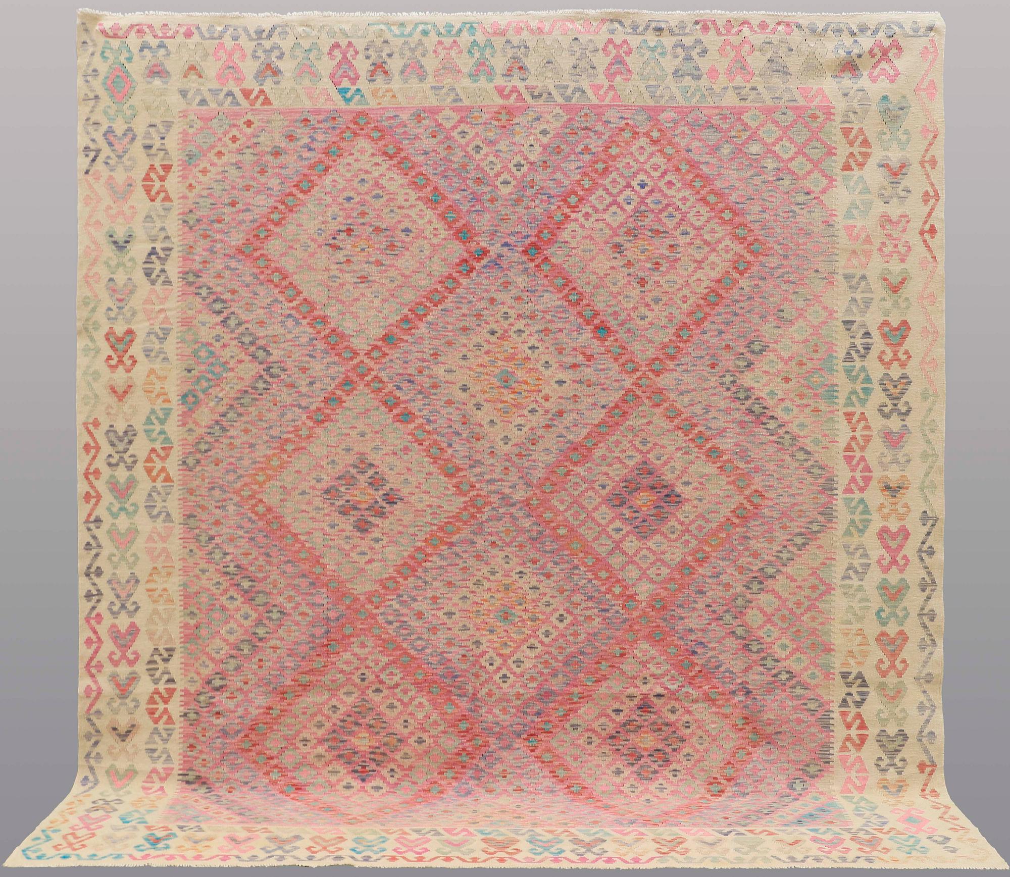 A CARPET, Kilim, ca 292 x 265 cm.