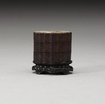 A three tiered wooden silver-inlayed box with cover, Qing dynasty.