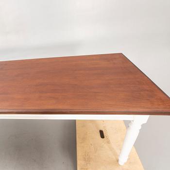 A painted and stained table 21st century.