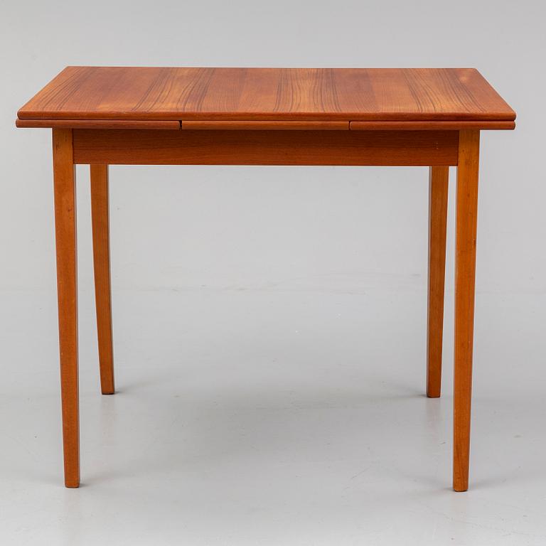 A 1950/60s teak veneered table.