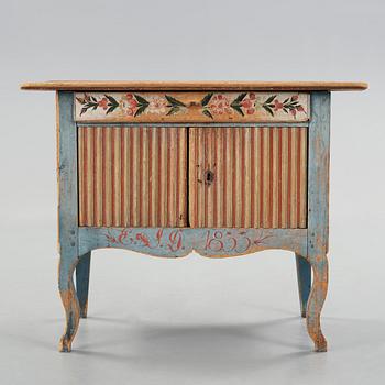 A painted pine table marked E.S.D 1833.