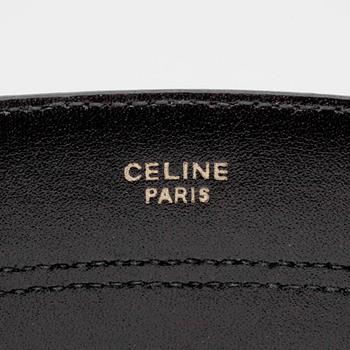 CÉLINE, a striped leather belt.