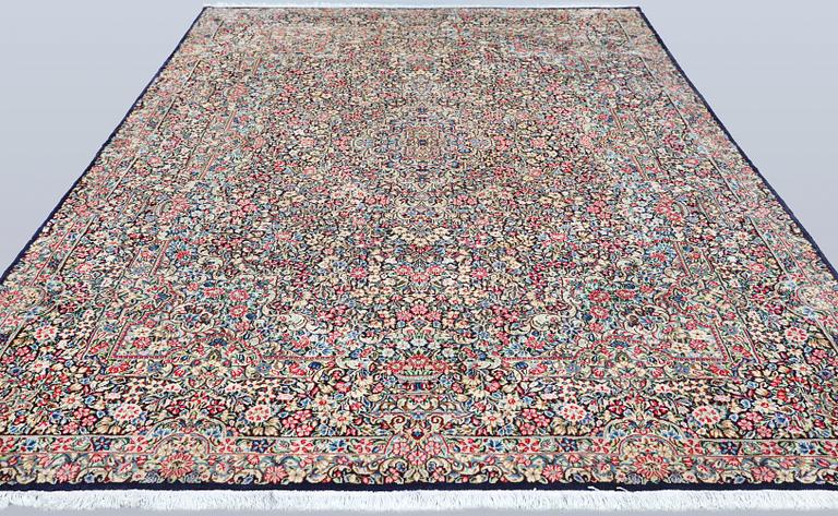 A Kirman Laver 'Millefleur' carpet, approx. 342 x 245 cm.