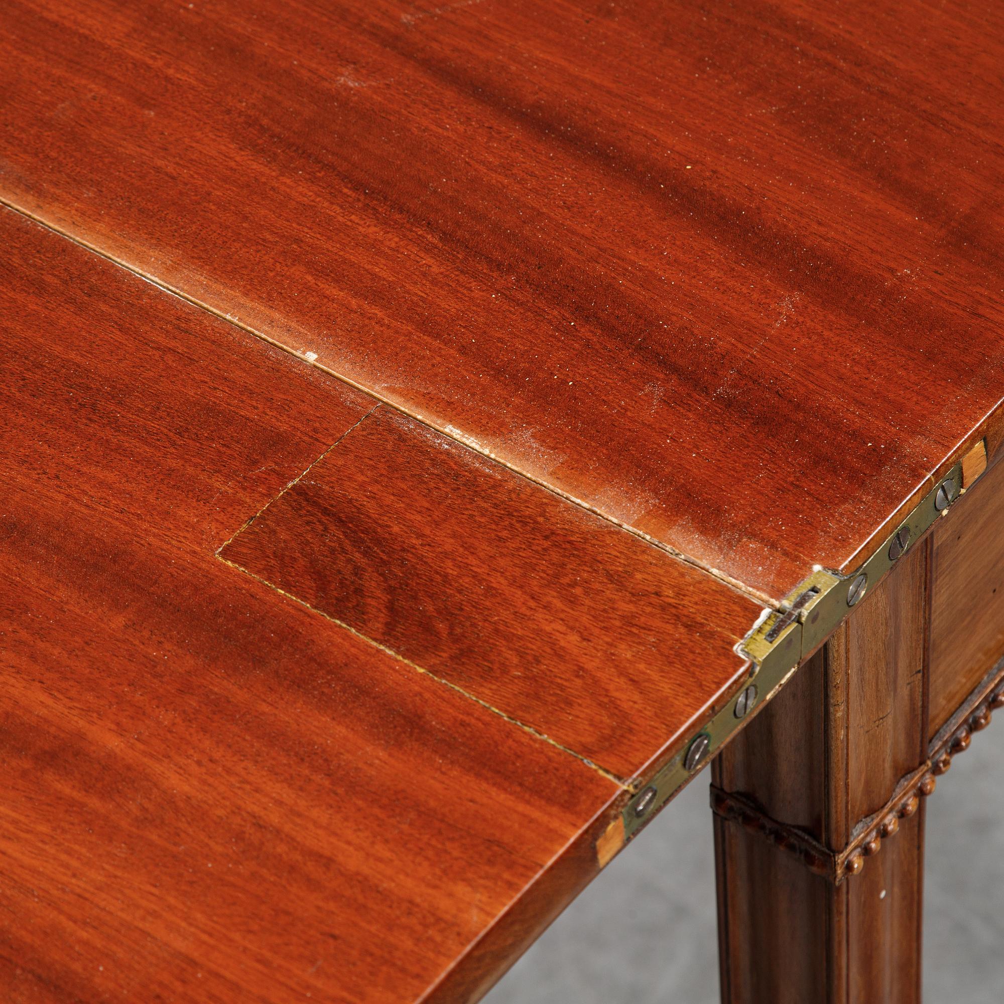 A mahogany games table, circa 1800.