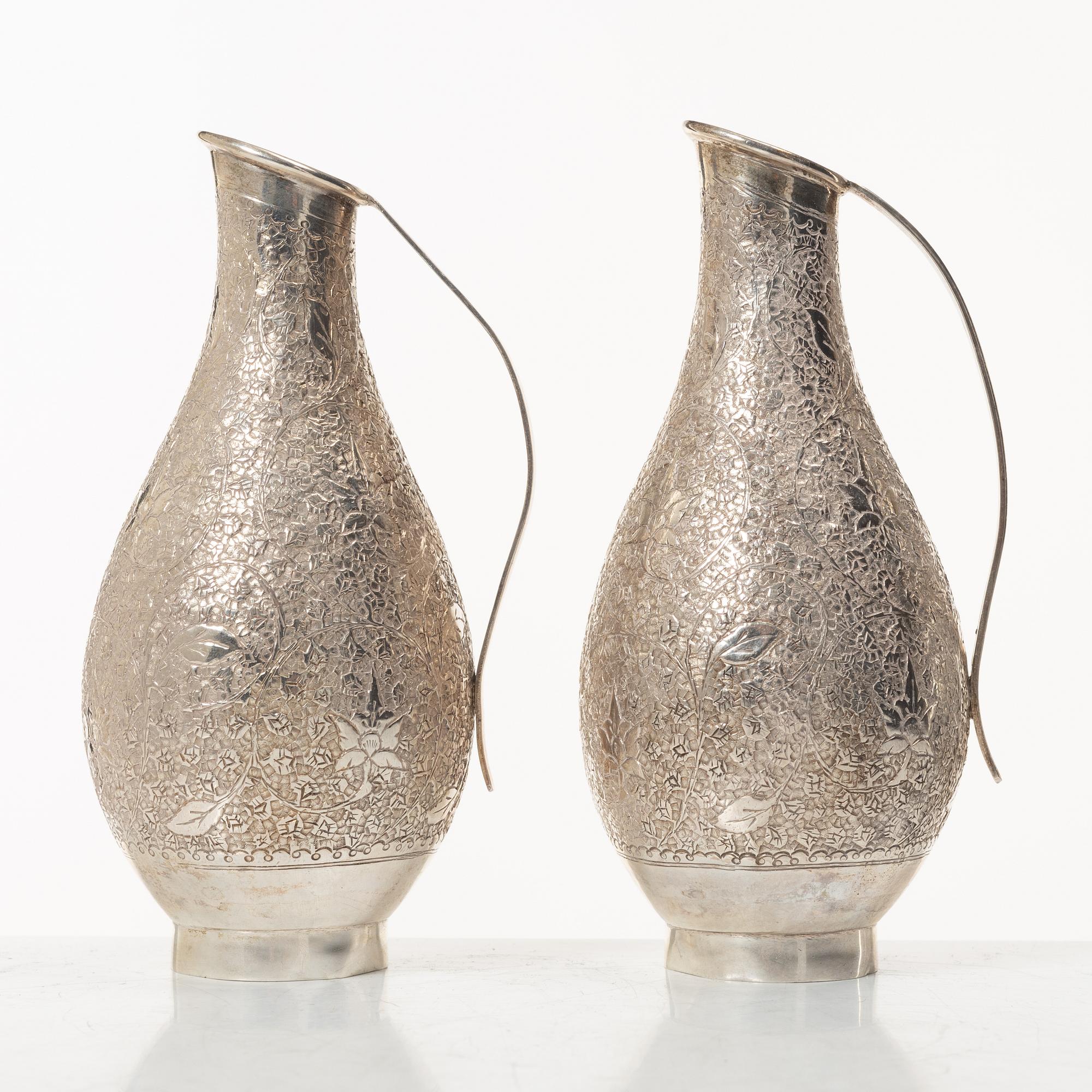A pair of jugs, silver, Pakistan, mid-20th century.