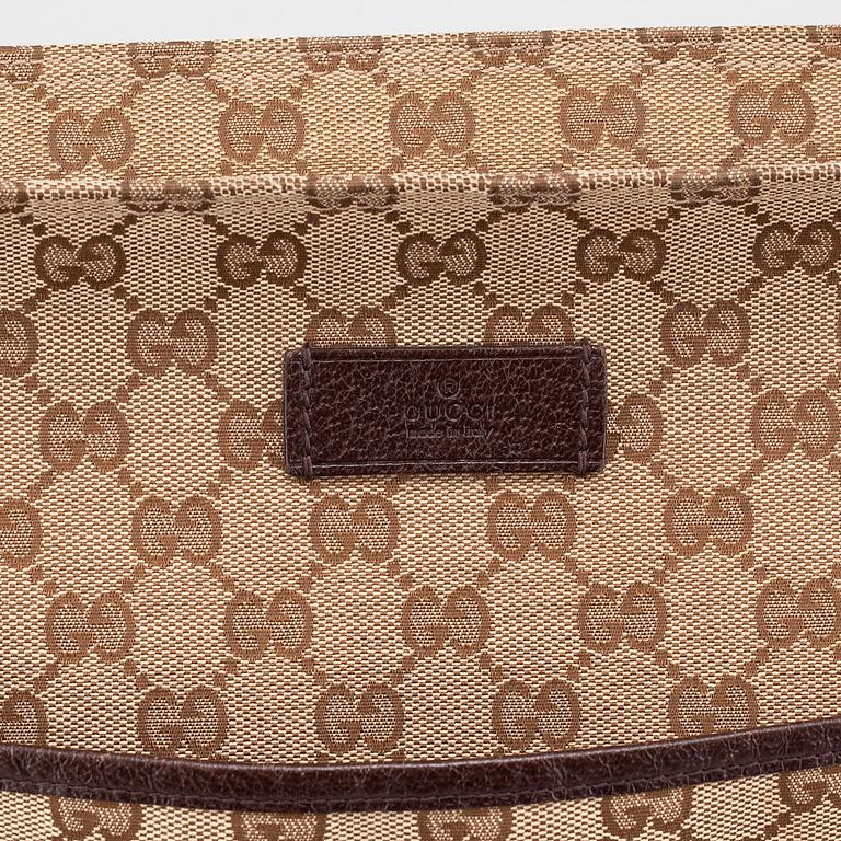 GUCCI, a "Messenger" bag.