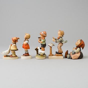 Five porcelain figurines, mostly Goebel.