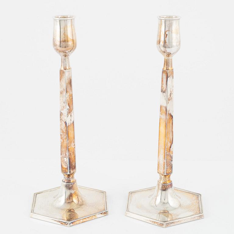 A pair of Swedish silver candlesticks, bearing the mark of K&EC, Gothenburg, 1965.