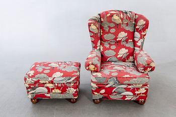 An easy chair with stool later part of the 20th century.