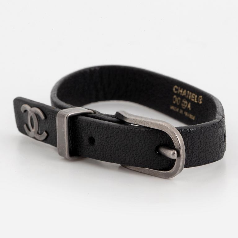 CHANEL, a leather bracelet.