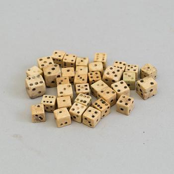 A COLLECTION OF 34 BONE MINIATURE DICE, 19th century.