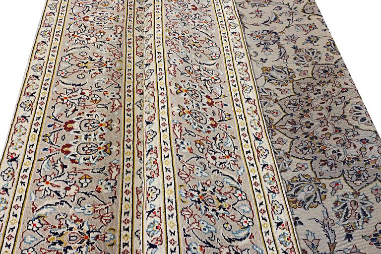 A Kashan carpet, c. 334 x 234 cm.