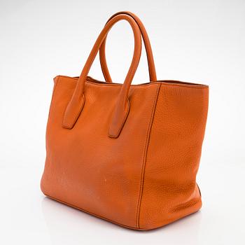 Prada, A 'Vitello Daino Tote' bag.