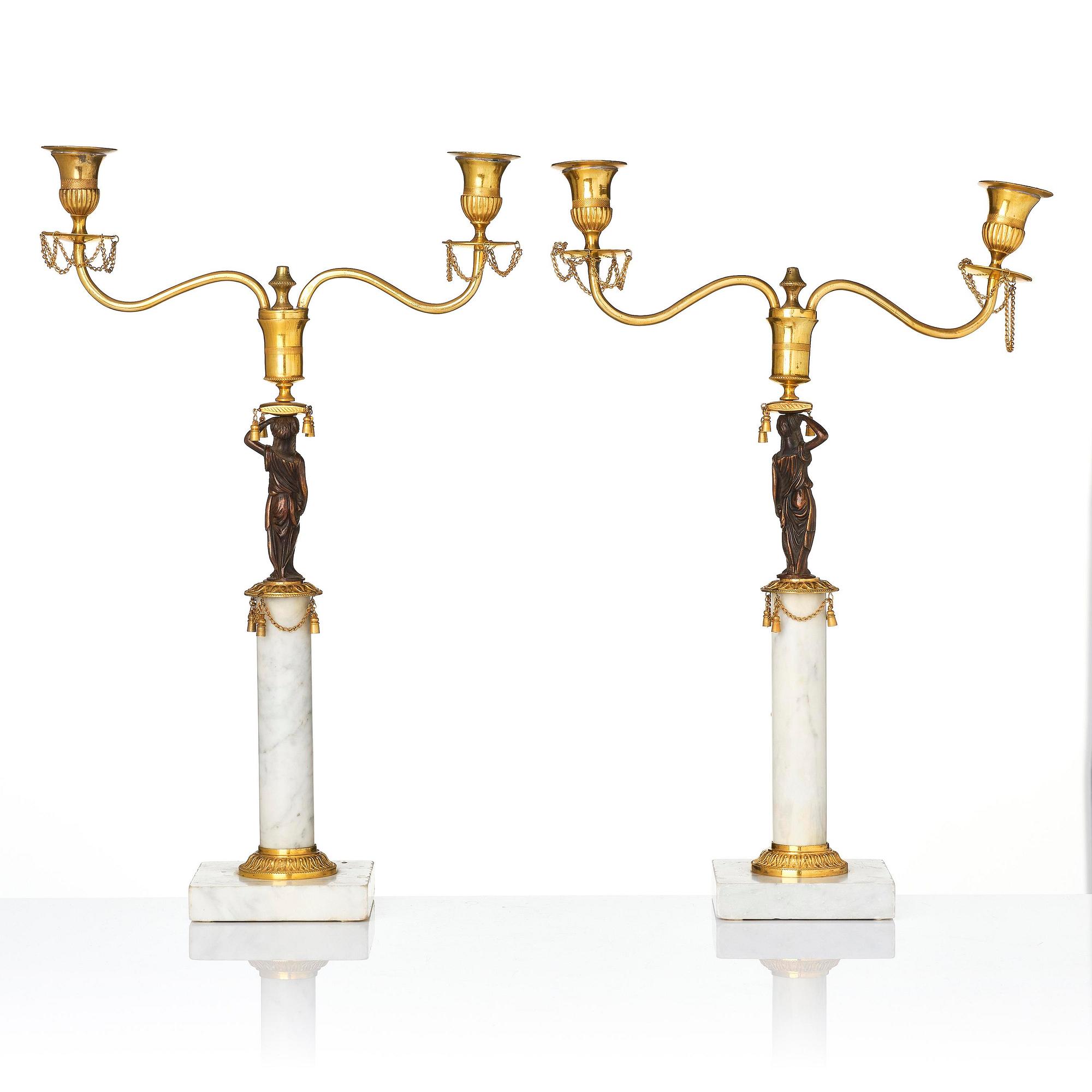 A pair of late Gustavian two-branch candelabra in the manner of F. L. Rung, Stockholm, circa 1800.